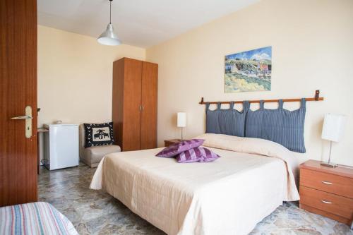 Postel nebo postele na pokoji v ubytování Attiko B&B