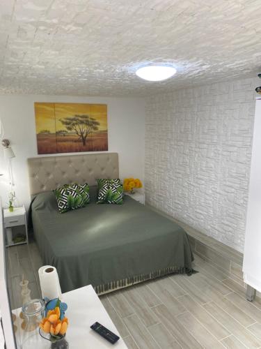 a bedroom with a bed and a table with oranges on it at Gönül Evim in Bogazici