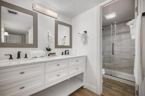a white bathroom with a sink and a shower at Great home, great location at a great price! in San Antonio