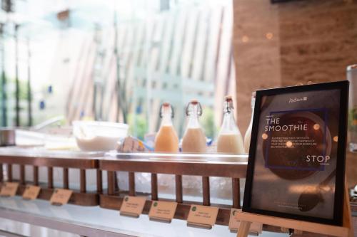 a store display with bottles of milk on a shelf at Radisson Blu Hotel, Nagpur in Nagpur