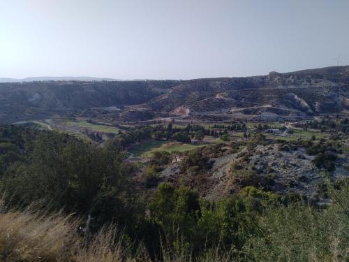 a view of the valley from the top of a mountain at Villa UNIDERA in Kouklia