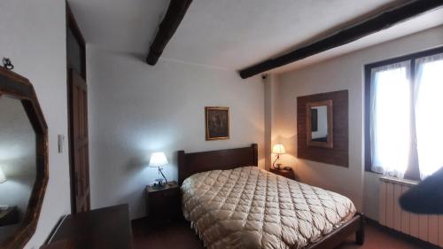 Postel nebo postele na pokoji v ubytování Agriturismo Fornace Certosa