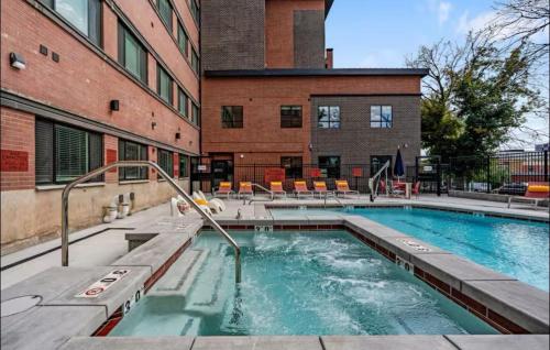 a swimming pool in front of a building at Luxury 2 bedroom 2 bath DT Stay in Salt Lake City