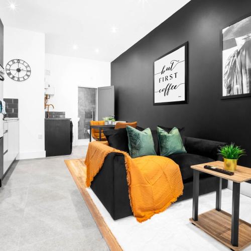 a living room with a couch and a table at Cozy Apartment - Netflix - On Street Parking - Rowley Regis 49G in Halesowen