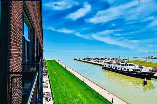 a group of boats are docked at a dock at Mario Room Waterfront Downtown View Cedar Point! in Sandusky