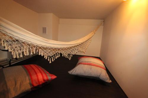 a bedroom with a bed and a mosquito net at Loft Niezapominajka w Tobaco Park in Łódź