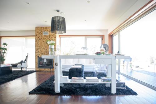 a living room with a couch and a table at Quinta Do Bosque in Mesão Frio