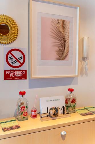 a shelf with a picture and other items on it at Apartamento Villa Rangel in Olivenza