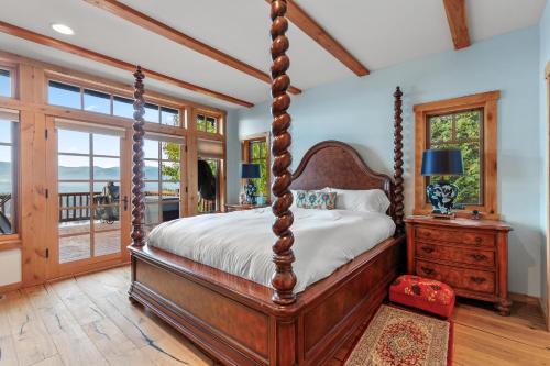 a bedroom with a four poster bed and a window at 818Forever in Lignite