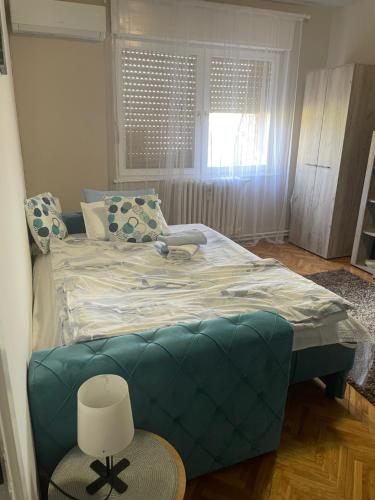 Postel nebo postele na pokoji v ubytování Apartman CENTAR