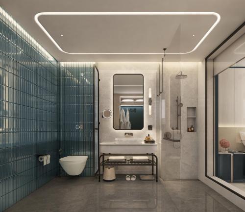 Un baño con lavabo e inodoro. en Crowne Plaza Dhaka Airport by IHG, en Dhaka