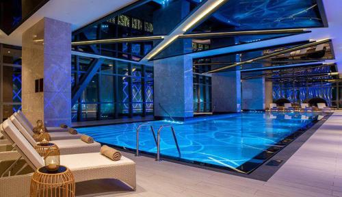 a large swimming pool in a building at BOULEVARD NEST RESlDENCE in Tashkent