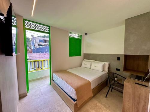 Ένα ή περισσότερα κρεβάτια σε δωμάτιο στο Green House Hotel