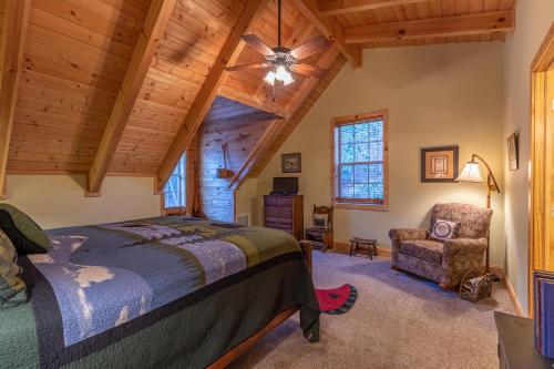 a bedroom with a bed and a chair at Bear Creek in Sugar Grove