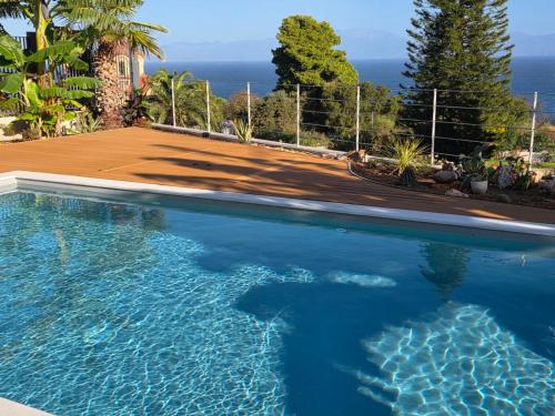 a swimming pool with a view of the ocean at Rastoni Studio Xylokastro 2 in Melission