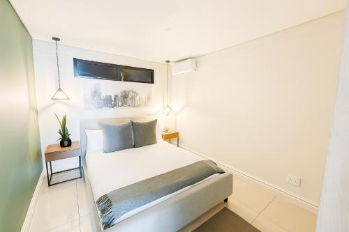 Ένα ή περισσότερα κρεβάτια σε δωμάτιο στο 1 BDR Apartment La Mercy