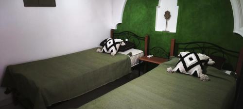 เตียงในห้องที่ Riad Naim