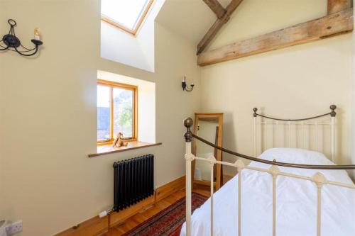 Ένα ή περισσότερα κρεβάτια σε δωμάτιο στο Woodsorrel Cottage