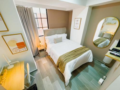 Giường trong phòng chung tại BIT by Simple stay