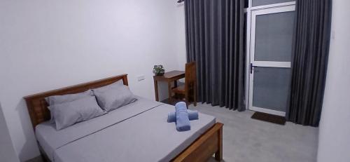 Ένα ή περισσότερα κρεβάτια σε δωμάτιο στο Wanguwa Lodge & Restaurant