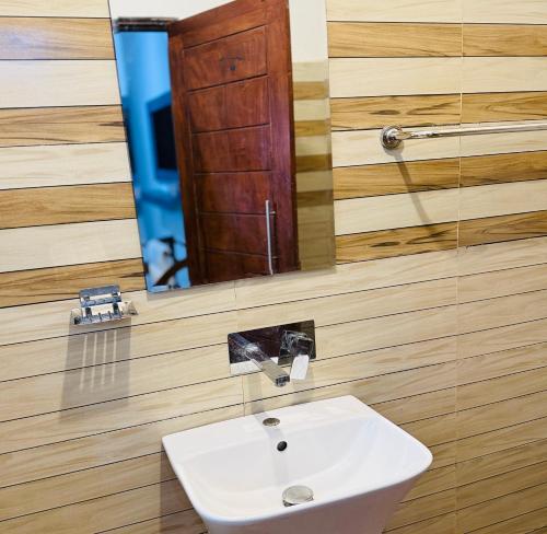 a bathroom with a sink and a mirror at The Lotus House - Ahangama in Ahangama
