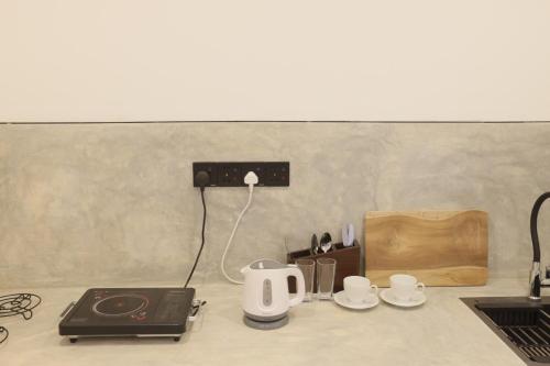 Příslušenství pro přípravu čaje a kávy v ubytování Mellow Yellow