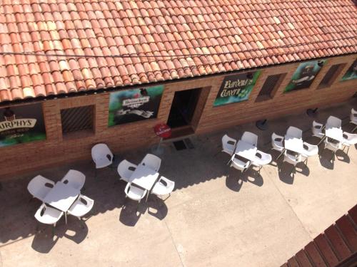 an overhead view of a group of tables and chairs at Apartamento Turistico Cigüeña de Arguedas in Arguedas