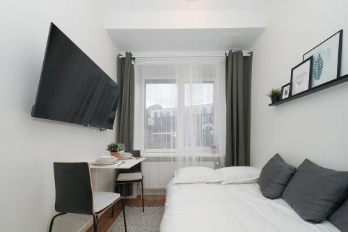 Voodi või voodid majutusasutuse Stylish Studio toas