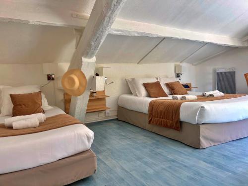 Postel nebo postele na pokoji v ubytování Les Callunes anciennement Le Beauséjour