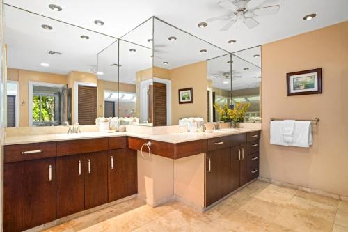 a bathroom with two sinks and two mirrors at Kapalua Bay Villas 2 Free Rental Cars KBM Resorts Large Master Suite 2 Units 3 Bedrooms ML-1528 in Honokahua