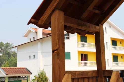 a view of a building from the back yard at Residencial Pinho Verde in Mealhada