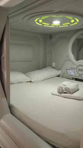 a bedroom with two beds in an airplane at min hostel reverencia in Madrid