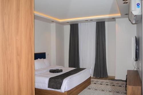 Katil atau katil-katil dalam bilik di Avenue Alarab Residence