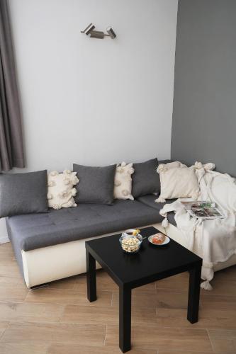 a living room with a couch and a table at Mrežnički kutak in Duga Resa