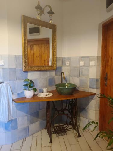 a bathroom with a sink and a mirror at glamping v jurtě na Hranáči in Nemojany