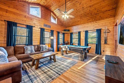 a living room with a couch and a pool table at Secluded Views Kings Pets Games 75 TV in Sevierville