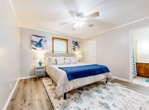 a bedroom with a bed and a ceiling fan at SLAUGHTER in Austin