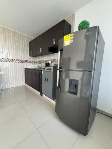 Kuchyň nebo kuchyňský kout v ubytování Apartamentos Full Confort en el corazón de Valledupa