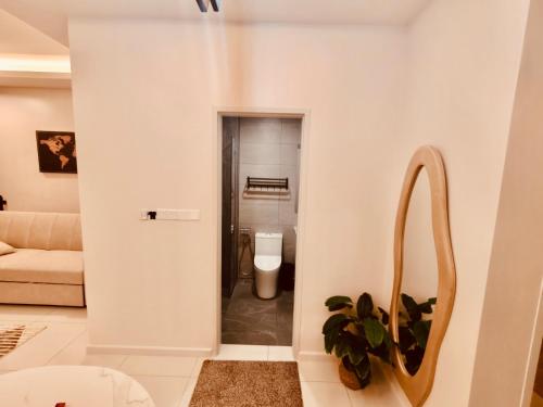 a living room with a couch and a piano at Majestic Residence KLCC By AFA in Kuala Lumpur