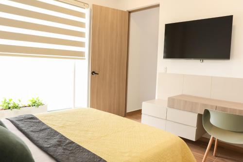 TV a/nebo společenská místnost v ubytování Casa del Viento 302