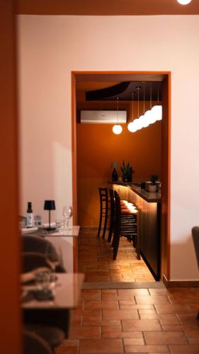 a dining room with a table and chairs at La Corte di Bacco Hotel & Ristorante in Cusano Mutri