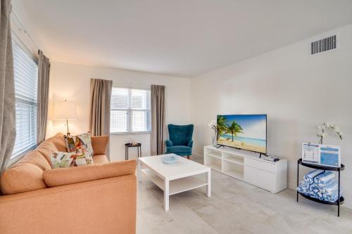 a living room with a couch and a tv at Approx 40 steps to beach entrance of Anna Maria beach in Anna Maria