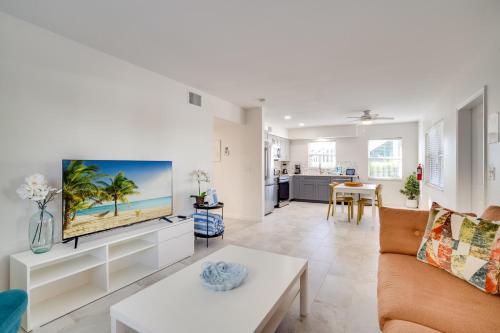 a living room with a couch and a tv at Approx 40 steps to beach entrance of Anna Maria beach in Anna Maria
