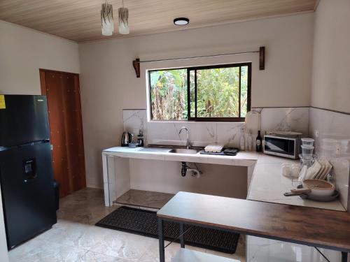 Kuchyň nebo kuchyňský kout v ubytování Casita Guarumo