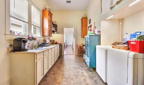 a kitchen with a sink and a dishwasher at Budget-Friendly Private Room with Homey Feel in Lafayette