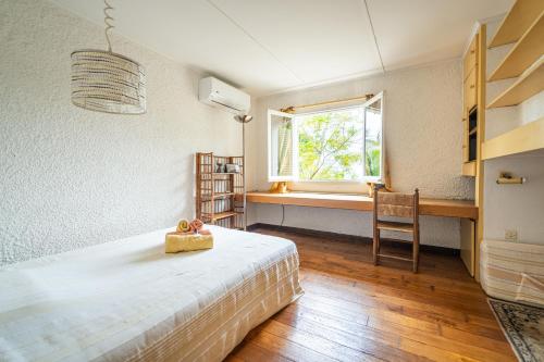 Ένα ή περισσότερα κρεβάτια σε δωμάτιο στο Villa Kaz Topaz - Spacieuse et Vue sur mer - Wiskeys