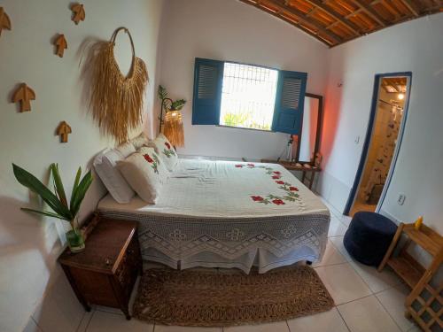 Ein Bett oder Betten in einem Zimmer der Unterkunft Chale 19 Praia do BarroPreto