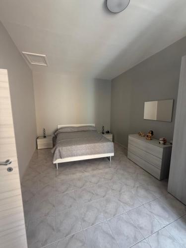 Ένα ή περισσότερα κρεβάτια σε δωμάτιο στο Da Zia Maria