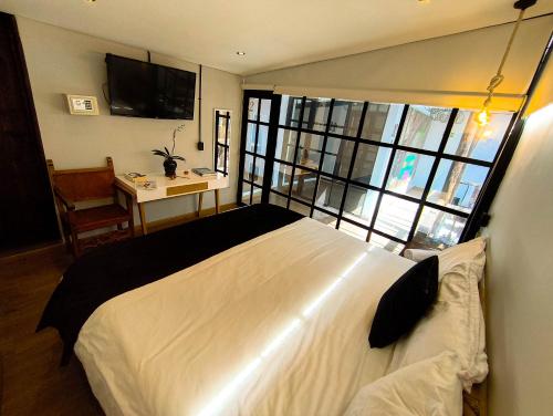 Postel nebo postele na pokoji v ubytování Hotel Quinta Bolivar