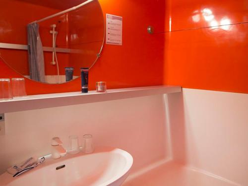 a bathroom with a sink and a mirror at Studio ski aux pieds avec balcon et fibre, 5 pers - FR-1-346-555 in Arc 1800